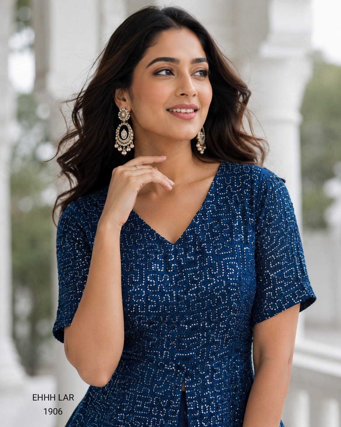 Georgette Sequins Embroidered Peplum Top with Shimmer Organza Lehenga.